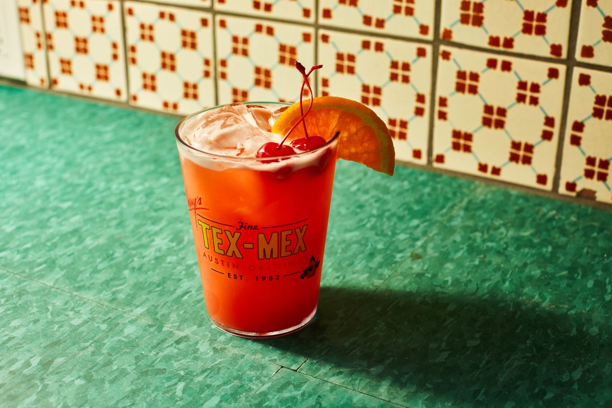 The King's Punch, served on a glass with two cherries and a slice of orange. Only at Chuy's.