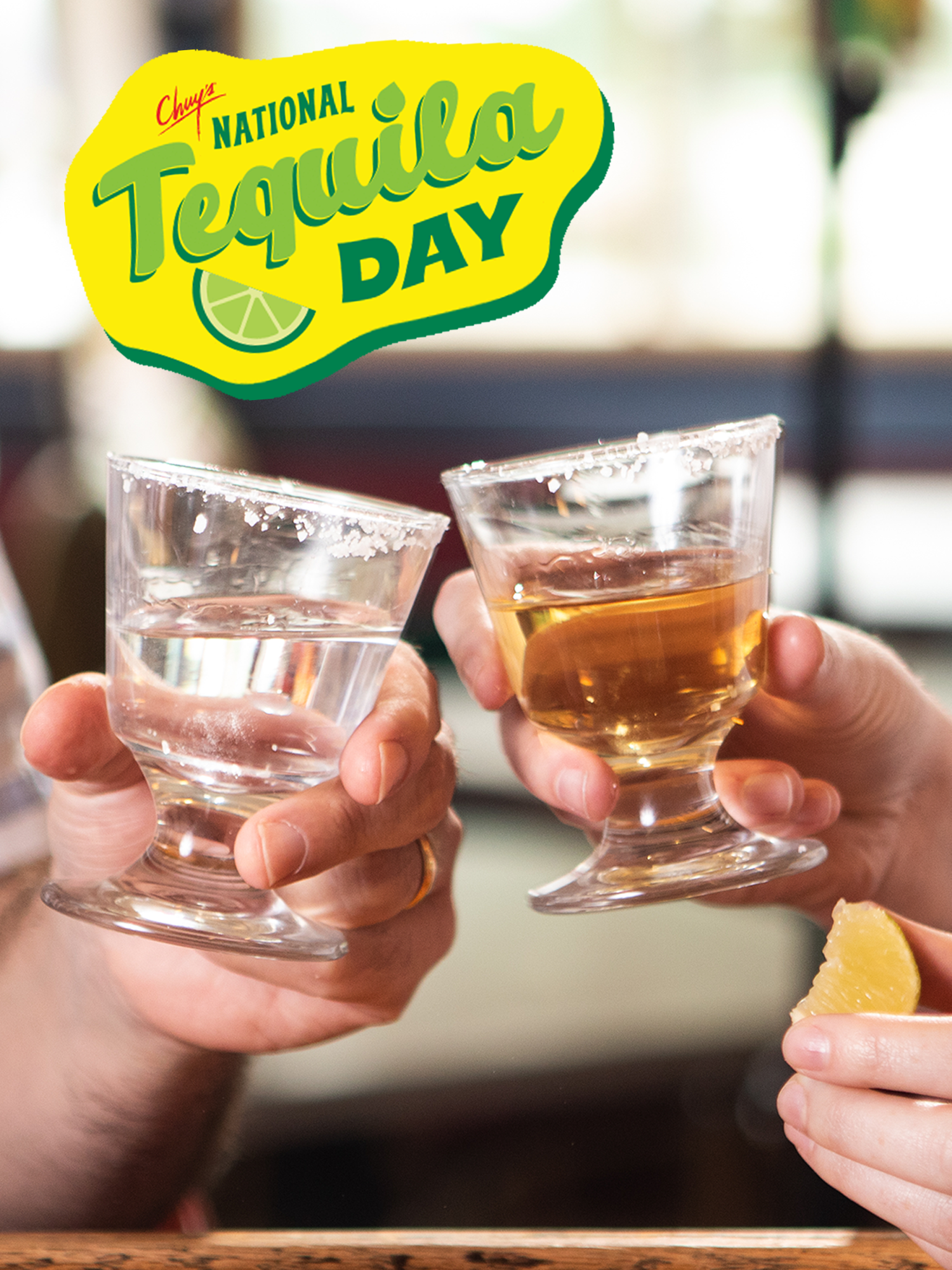 Text reading: 'Chuy's National Tequila Day' with two shot glasses filled with Tequila being hit together ready to drink.