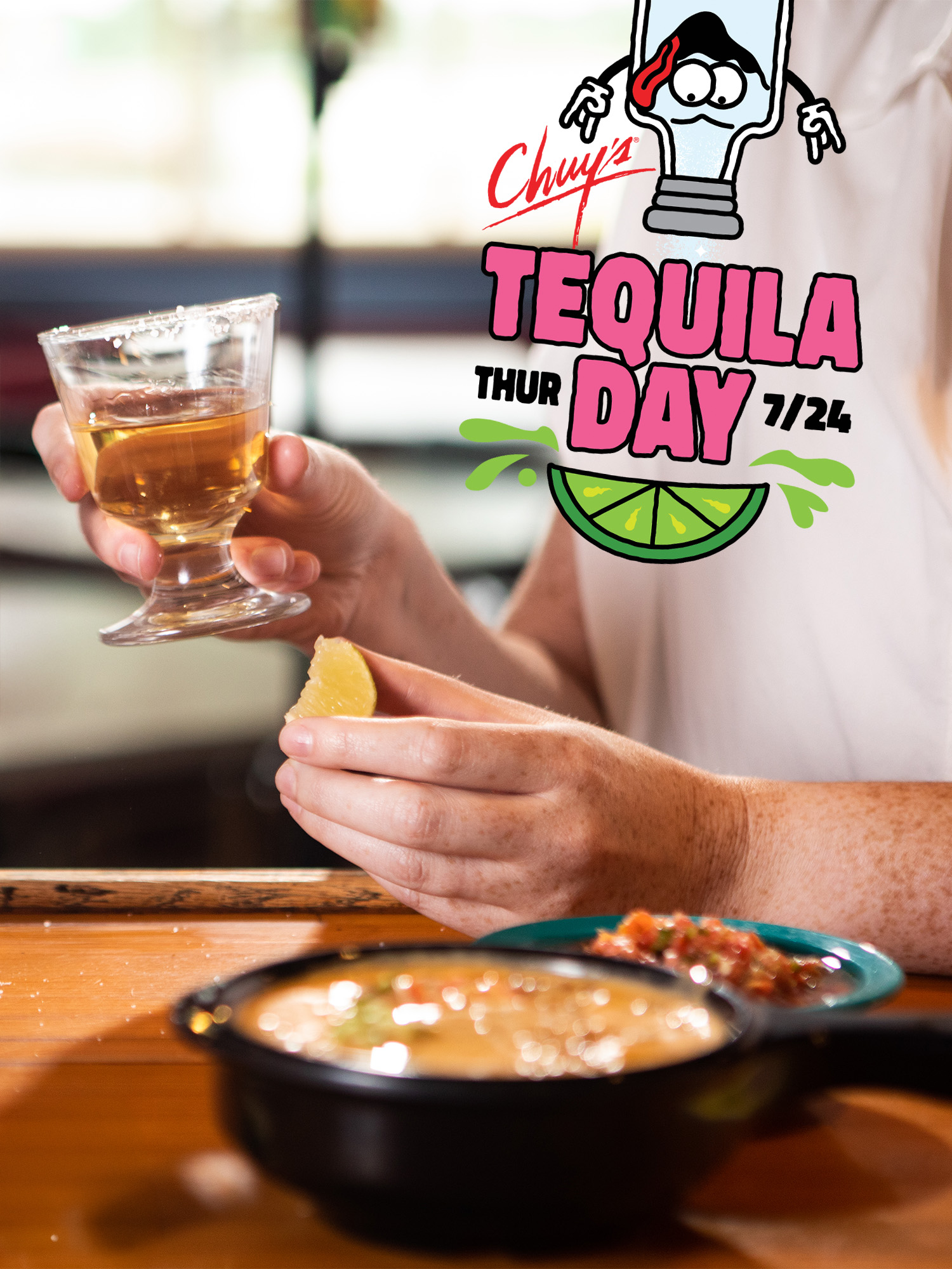 Two shots of tequila hitting against each other with text above that reads: 'Chuy's National Tequila Day'.