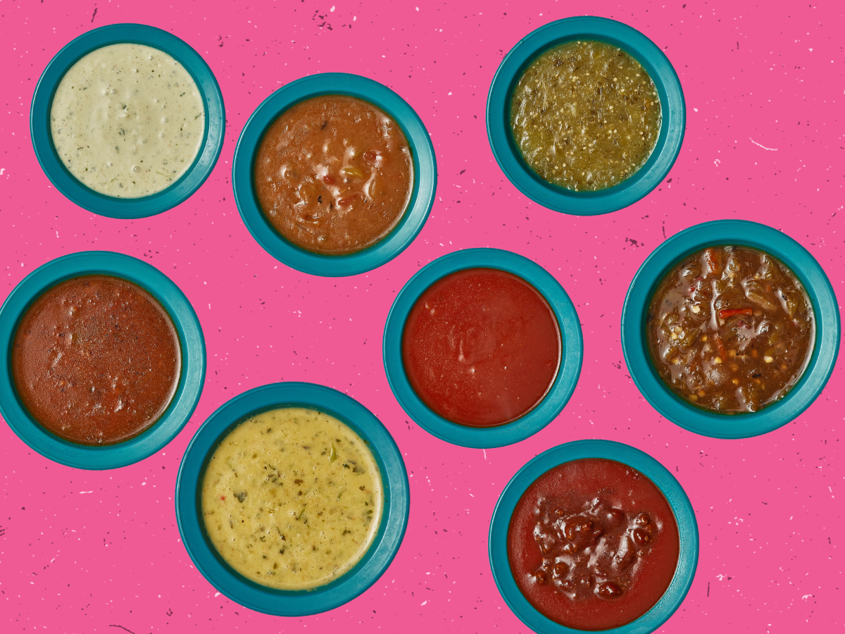 Various Chuy's sauces on a pink background.